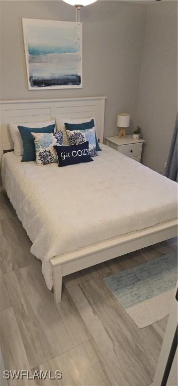 bedroom featuring wood finished floors