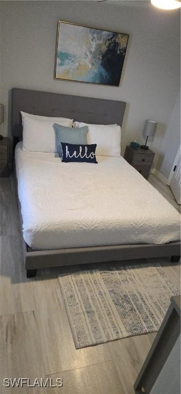 bedroom featuring wood finished floors