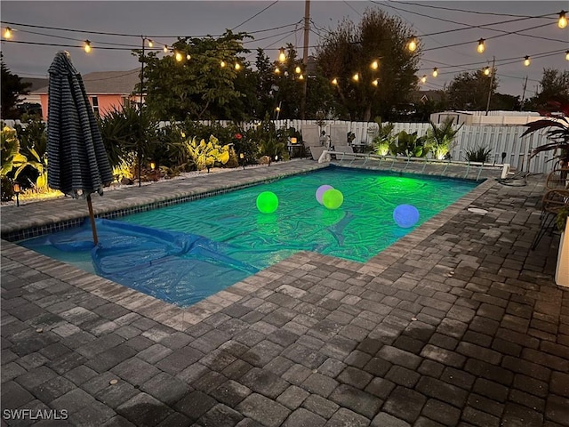 view of pool with a patio, a fenced backyard, and a fenced in pool