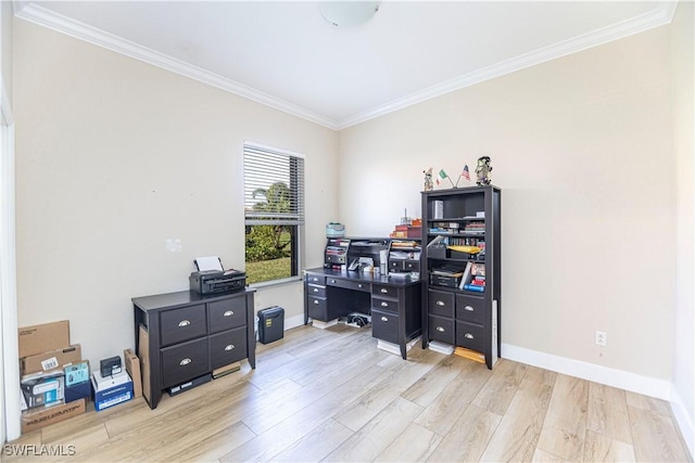 home office featuring light wood-type flooring, crown molding, and baseboards