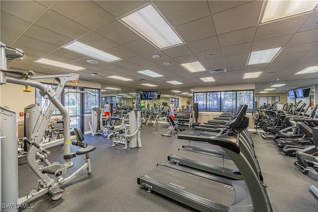 gym featuring visible vents and a paneled ceiling