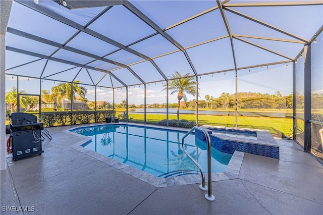 view of pool with grilling area, a patio area, a lanai, and a pool with connected hot tub