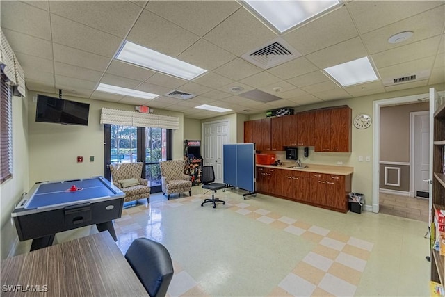 game room featuring visible vents, a sink, and light floors