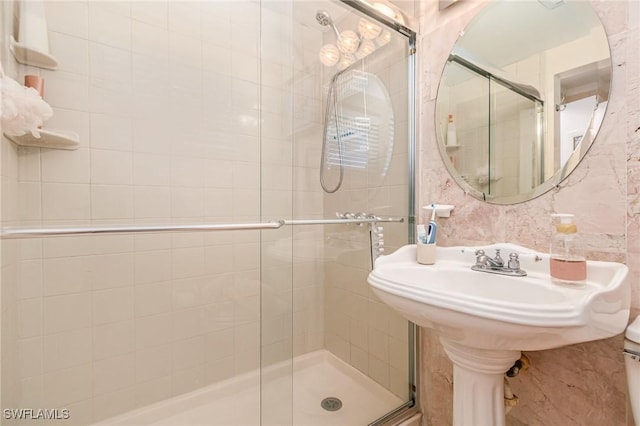 bathroom featuring a shower stall