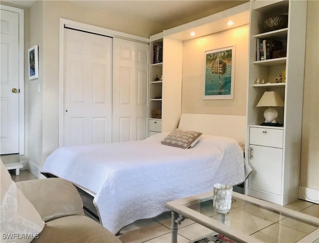 bedroom with a closet and baseboards