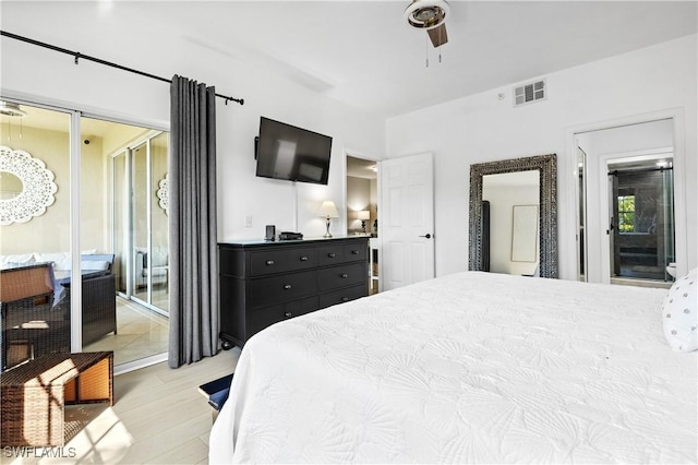 bedroom featuring ceiling fan, access to outside, wood finished floors, and visible vents