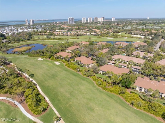 aerial view featuring view of golf course and a water view