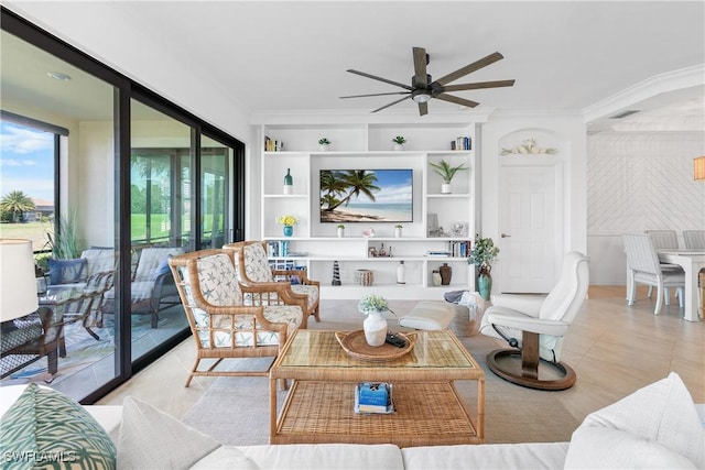 living area featuring visible vents, built in features, a ceiling fan, ornamental molding, and light tile patterned flooring