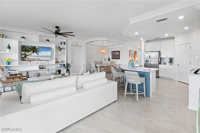 living area featuring ceiling fan, ornamental molding, visible vents, and recessed lighting