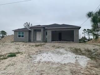 view of front of home with a garage and driveway