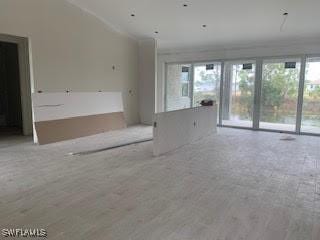 unfurnished living room with lofted ceiling and wood finished floors