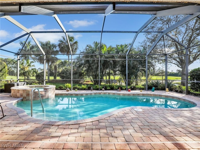 view of swimming pool featuring a patio area and a pool with connected hot tub