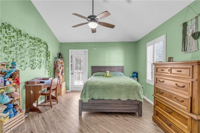 bedroom with lofted ceiling, ceiling fan, light wood-style flooring, baseboards, and access to outside