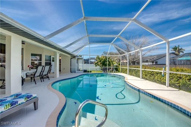 view of pool featuring a patio, glass enclosure, fence, and a fenced in pool