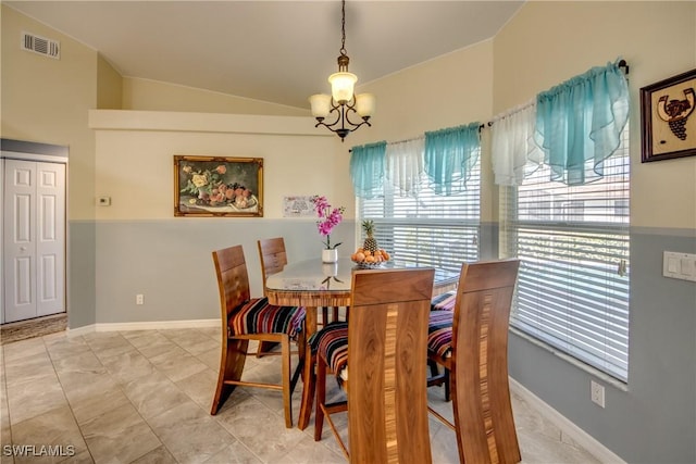 dining room featuring lofted ceiling, visible vents, baseboards, and an inviting chandelier