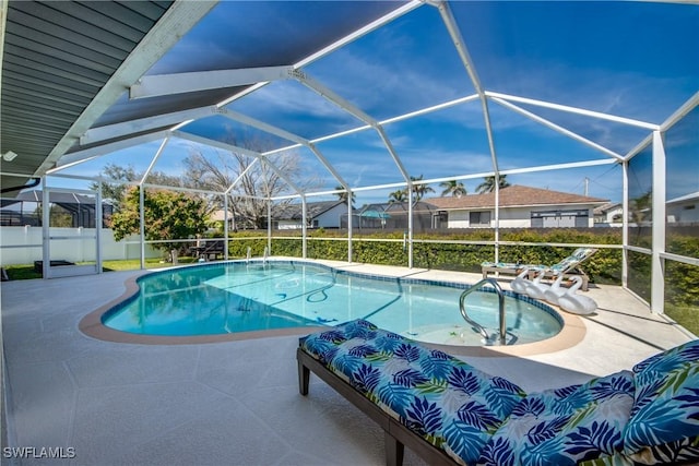 view of pool featuring a lanai, a patio area, and a fenced in pool