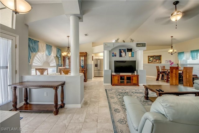 living area featuring decorative columns, visible vents, baseboards, lofted ceiling, and ceiling fan with notable chandelier