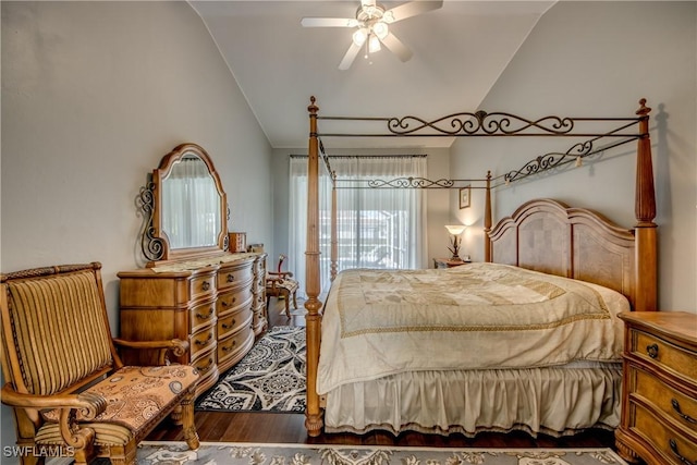 bedroom with vaulted ceiling and wood finished floors