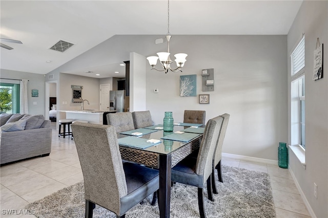 dining space featuring lofted ceiling, light tile patterned flooring, baseboards, and visible vents