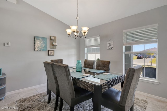 dining room with lofted ceiling, a notable chandelier, baseboards, and light tile patterned floors