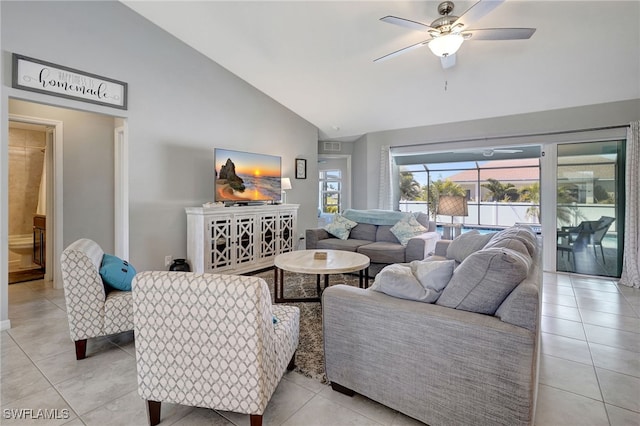 living room with high vaulted ceiling, light tile patterned floors, and ceiling fan