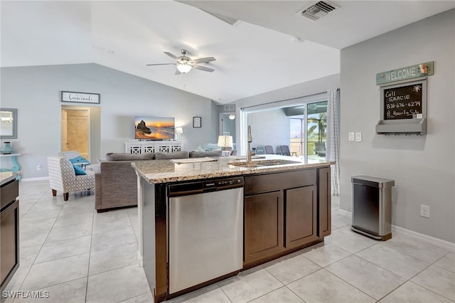 kitchen featuring stainless steel dishwasher, light tile patterned floors, visible vents, and a sink