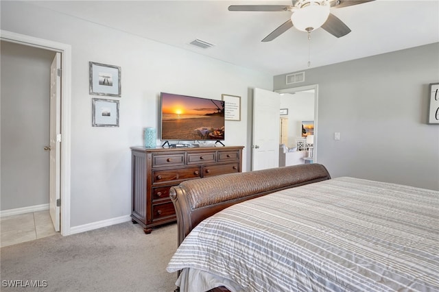 bedroom featuring visible vents, light carpet, baseboards, and a ceiling fan