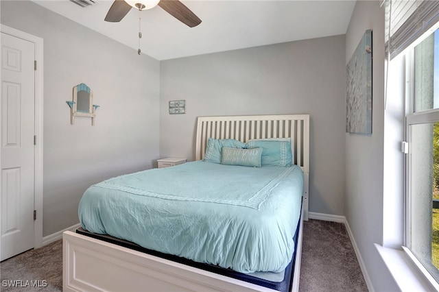 bedroom with carpet flooring, a ceiling fan, and baseboards