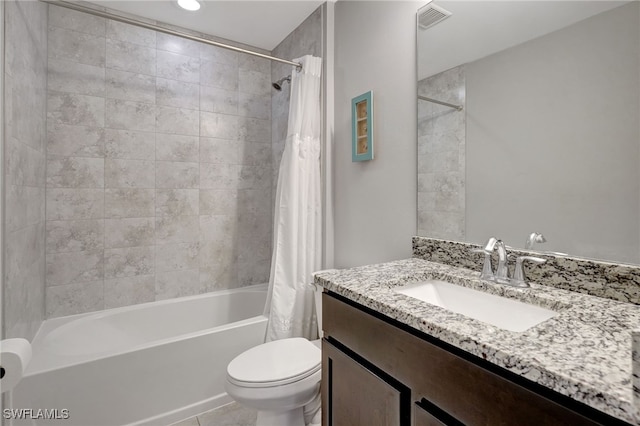 bathroom featuring vanity, toilet, shower / bath combo, and visible vents