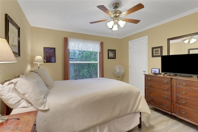 1442 SE 15th Ter, Cape Coral, FL 33990 - bedroom featuring light wood-style flooring, ornamental molding, and a ceiling fan