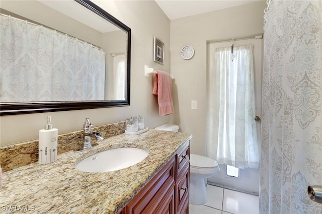 1442 SE 15th Ter, Cape Coral, FL 33990 - bathroom with toilet, vanity, and tile patterned flooring