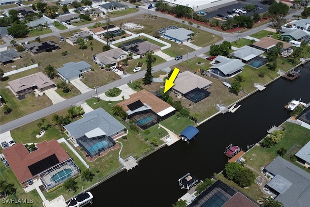 1442 SE 15th Ter, Cape Coral, FL 33990 - aerial view of property and surrounding area featuring a nearby body of water and nearby suburban area