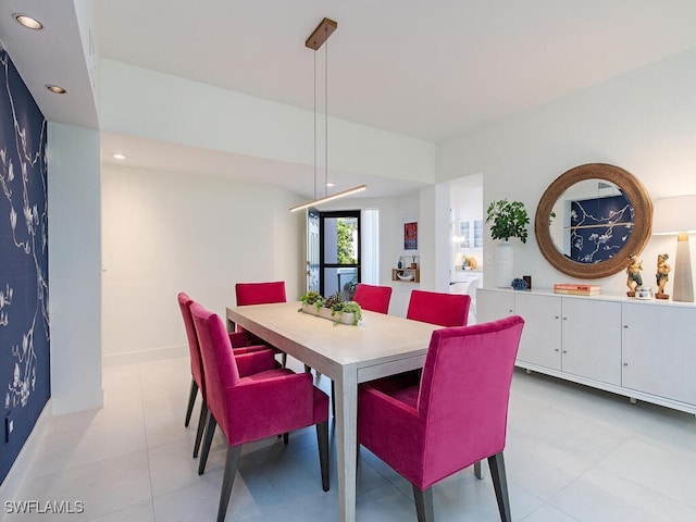 dining room with baseboards and recessed lighting