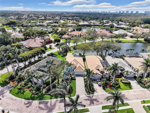 bird's eye view featuring a residential view and a water view