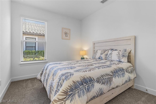 bedroom featuring visible vents, baseboards, and carpet floors