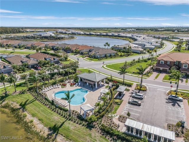 bird's eye view featuring a residential view and a water view