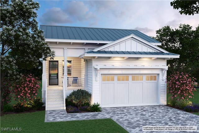 2448 Florida Ave, Naples, FL 34112 - view of front of property featuring a standing seam roof, decorative driveway, and metal roof