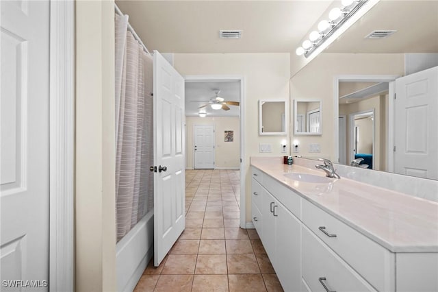 full bathroom with shower / bath combo, visible vents, vanity, and tile patterned floors