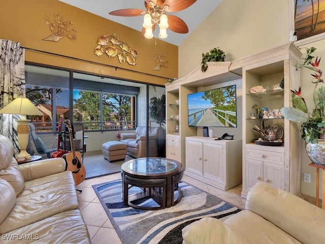 living room with high vaulted ceiling, light tile patterned flooring, and ceiling fan