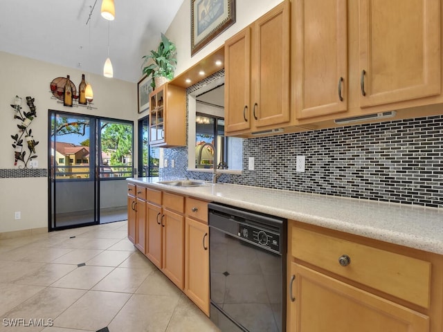 kitchen featuring light tile patterned floors, a sink, black dishwasher, light countertops, and backsplash