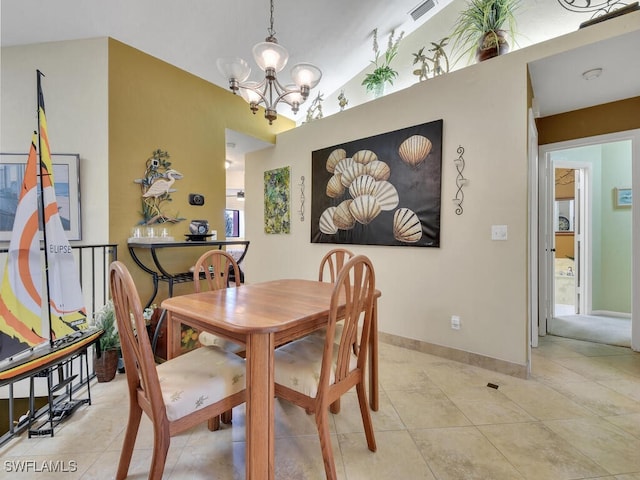 dining room with baseboards, vaulted ceiling, a notable chandelier, and light tile patterned flooring