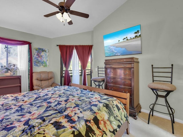 bedroom featuring multiple windows, baseboards, vaulted ceiling, and light colored carpet