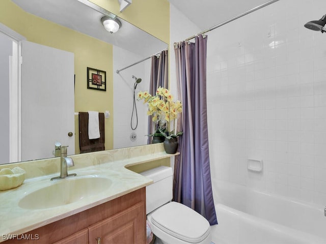 full bath with toilet, shower / bath combo with shower curtain, and vanity