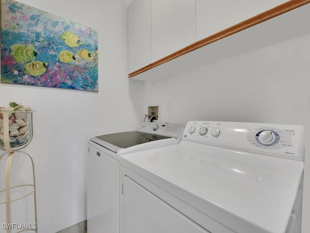 laundry room with cabinet space and washer and dryer