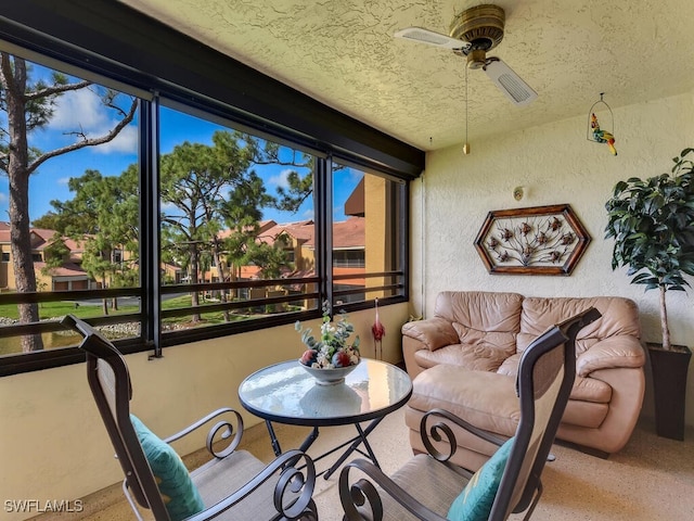 sunroom / solarium with ceiling fan