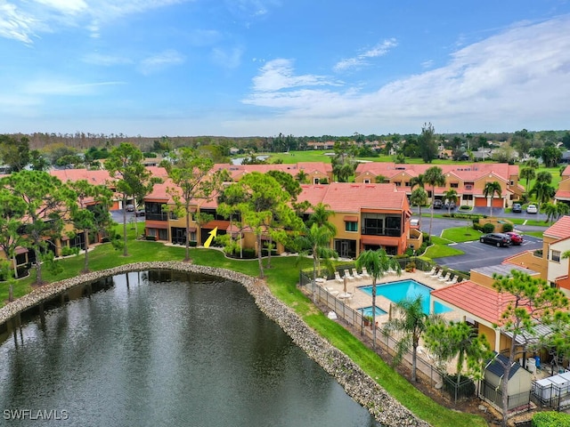 bird's eye view featuring a residential view and a water view