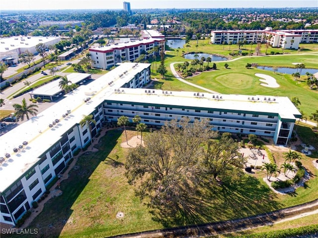 aerial view featuring a water view and view of golf course