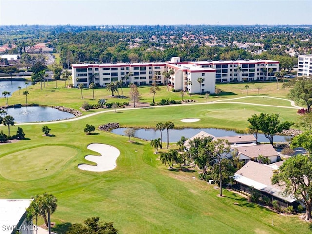 birds eye view of property featuring a water view and view of golf course