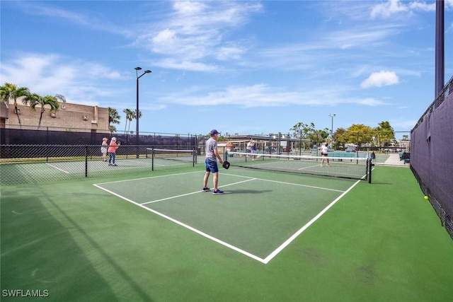 view of sport court with community basketball court and fence