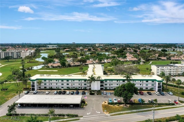 bird's eye view with golf course view and a water view